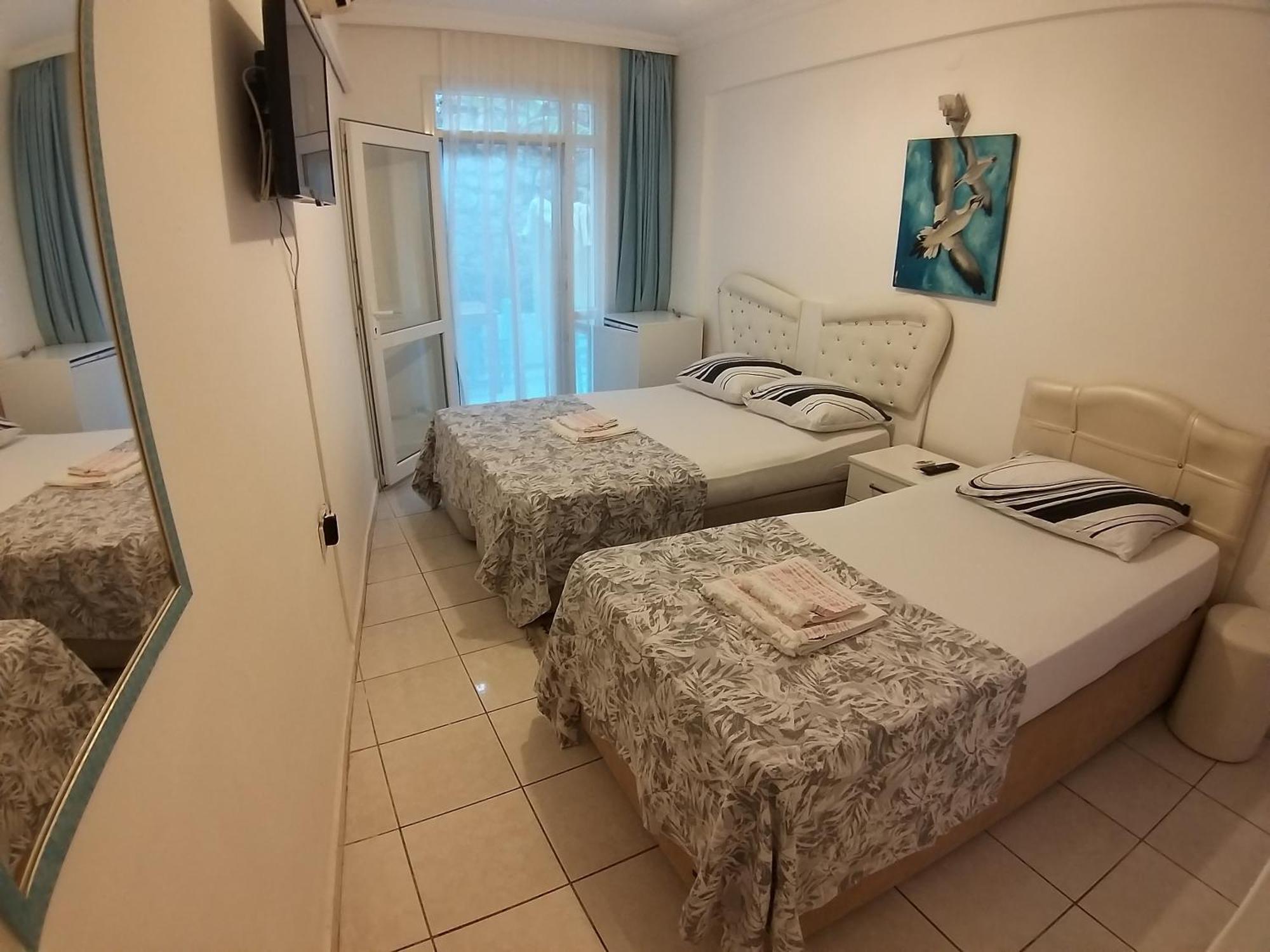Beyaz Apart Pansiyon Кешме Экстерьер фото